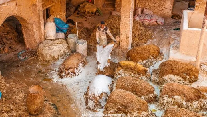 Visiting the leather tanneries of Fes in Morocco is quite the experience. Unchanged for centuries, it's one of the unforgettable things to do in Fes.