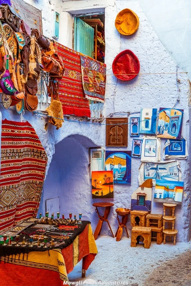 Exploring the magic of Chefchaouen, Morocco's blue city. The residents of Chefchaouen have painted everything blue and white. The buildings, the pavements, the steps and the doors are all painted in a multitude of shades of blue. #Travel #Morocco #Chefchaouen #TravelGuide Click this link for the full article //mowgli-adventures.com/chefchaouen-morocco-blue-city/