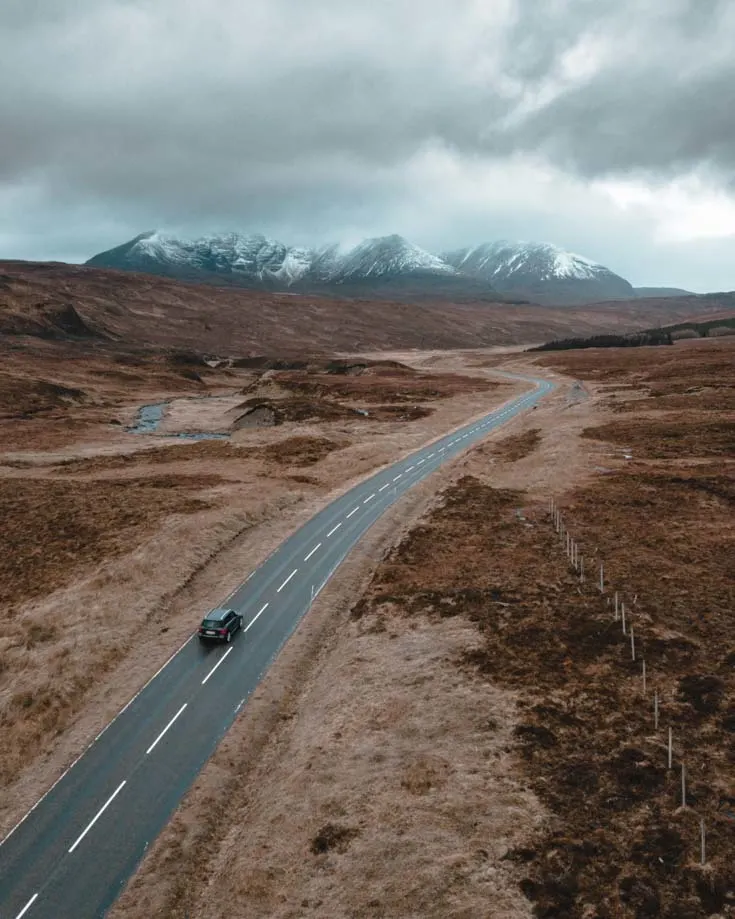 An aerial view of narrow lanes on the NC500 in Scotland