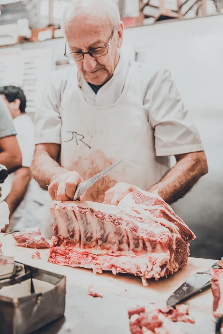 A butcher in Mercado de San Telmo market Buenos Aires