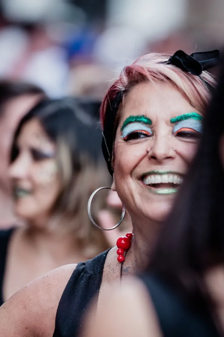A female Candombe dancer laughing in full make up