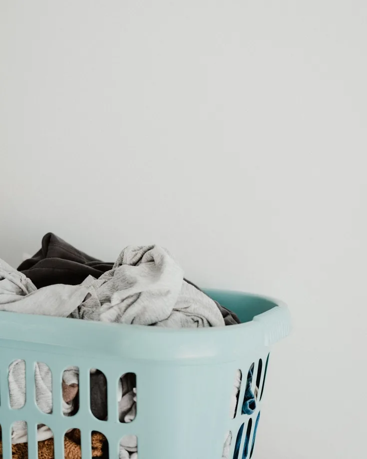 A basket of dirty clothes - campervan ventilation can help eliminate odours