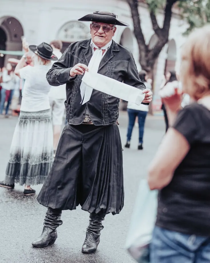 Folkloric dancer dressed in black at Feris de Mataderos Buenos Aires