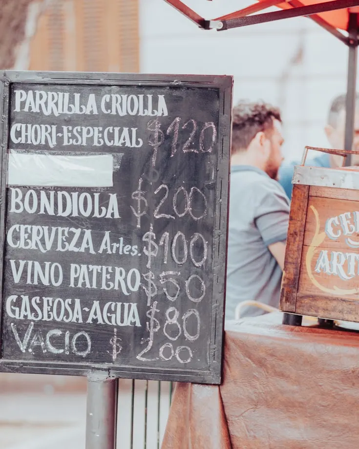 price board for street food in Mataderos street market
