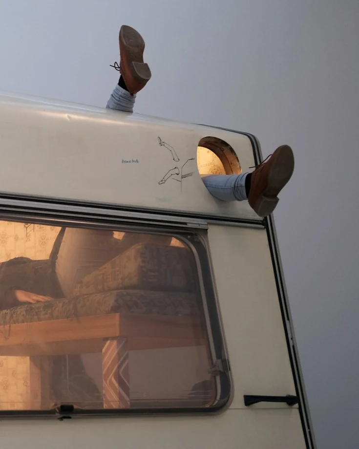 legs sticking out of a campervan