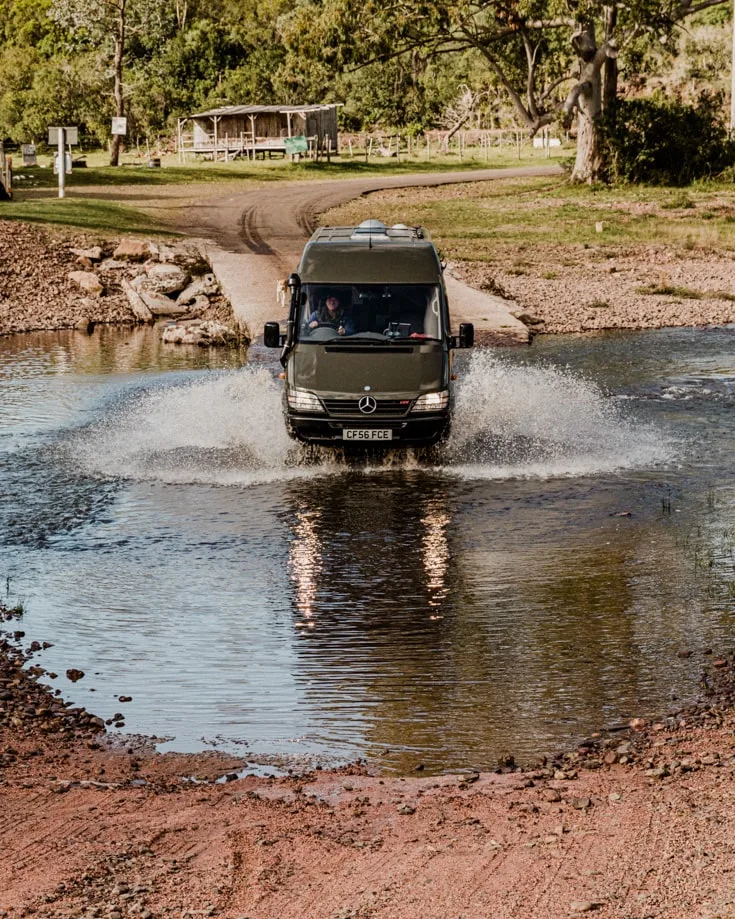 Camper van conversion driving through water