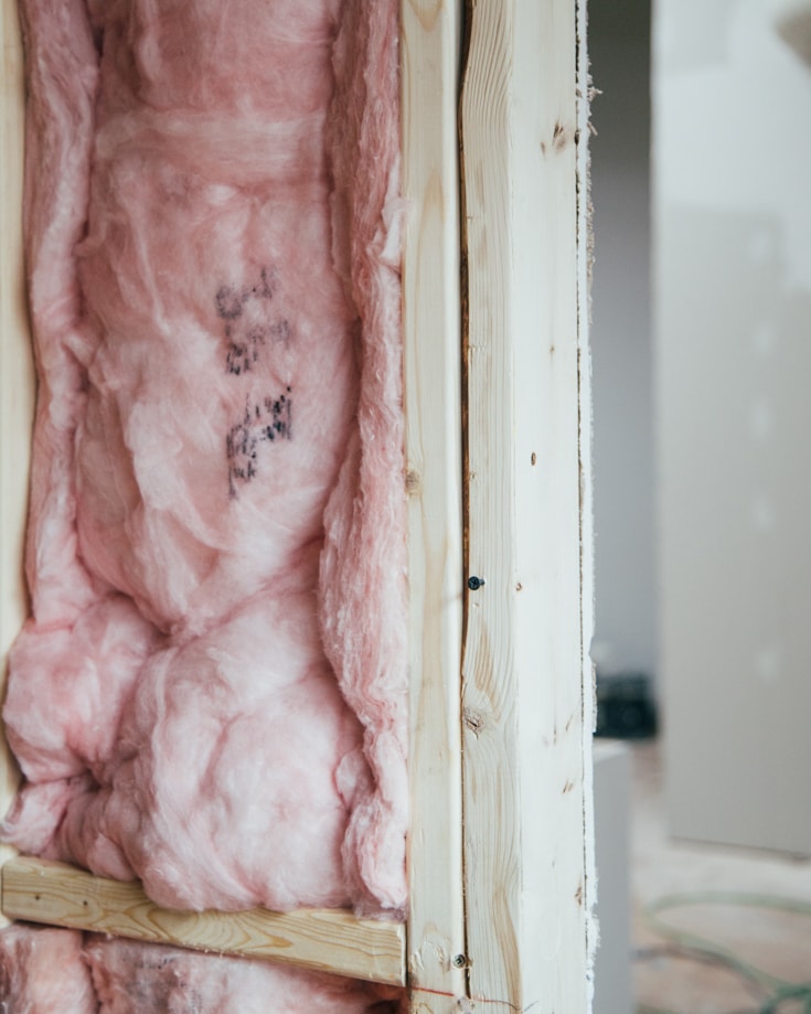 pink insulation wool in a wall