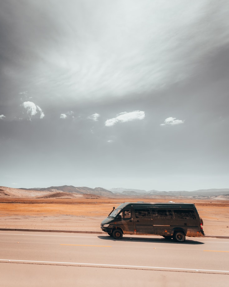 A sprinter campervan driving in Bolivia in the altiplano