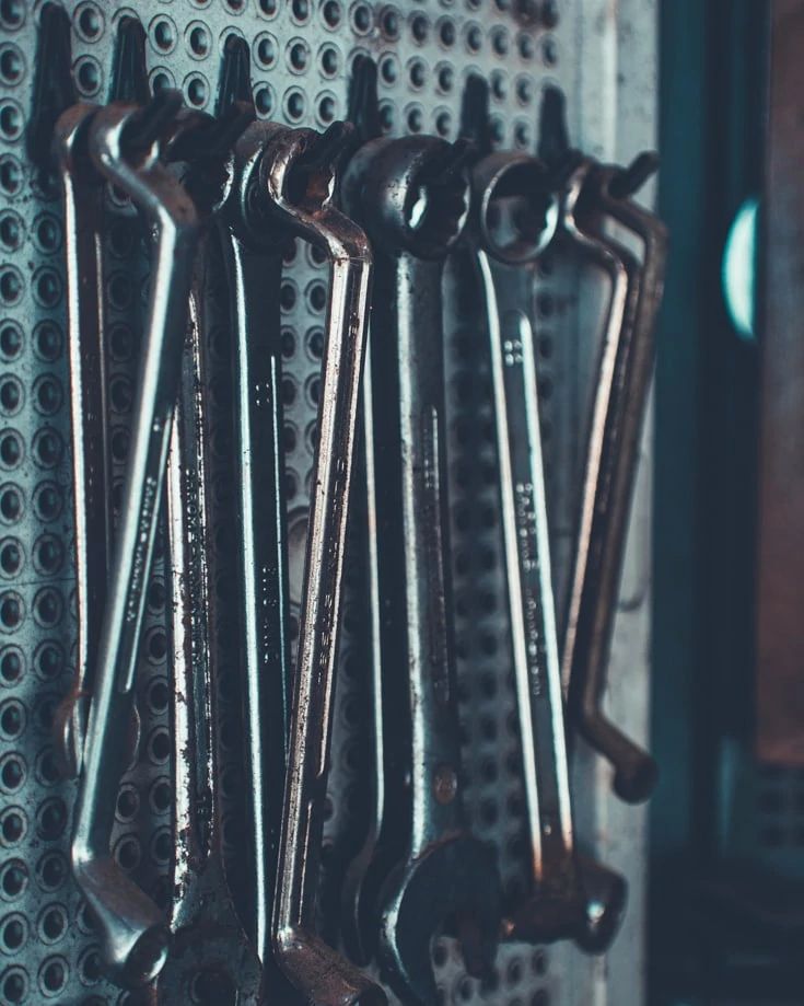 Spanners hanging up on a wall in a garage