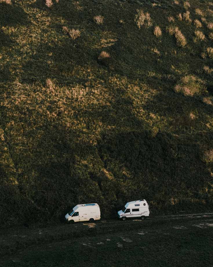 2 campervans parked in the the wilderness