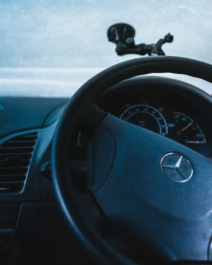 Mercedes Sprinter campervan steering wheel and snow covered windscreen