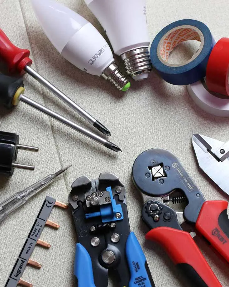 overhead photo of electrical tools laid out on a table