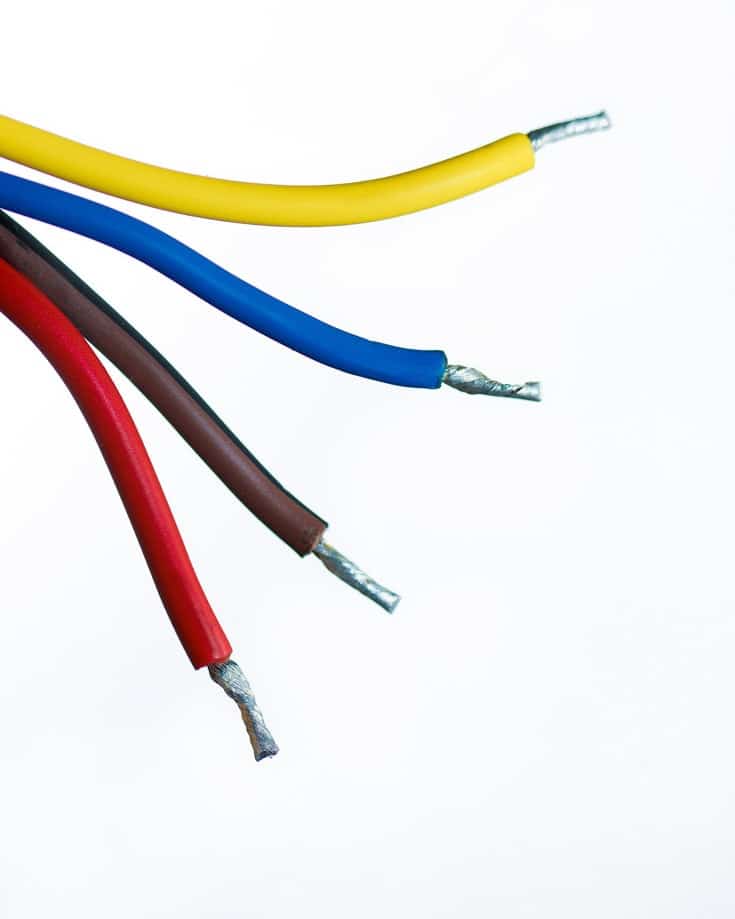 4 bare wires on a white background