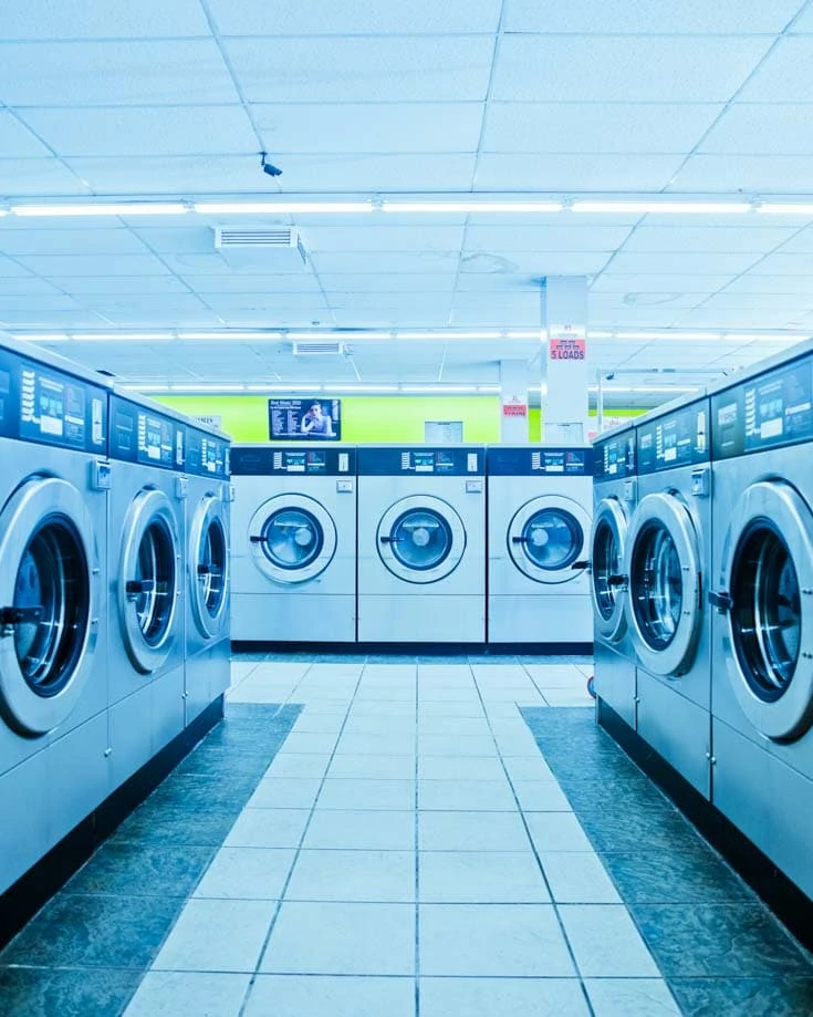 van life laundry tips - washing machines in a laundromat