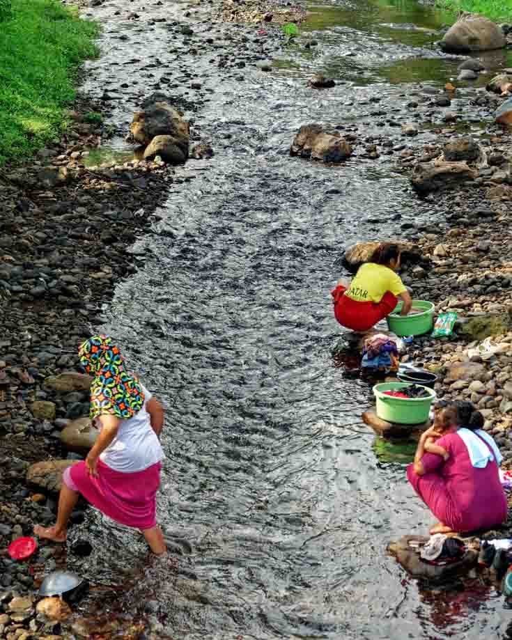 Women washing clothes in a river