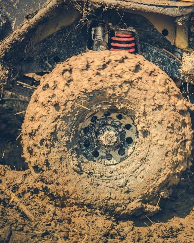 Mud covered wheel of a 4x4