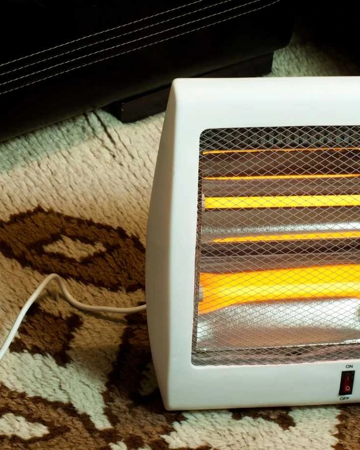 Electric heater bar glowing orange