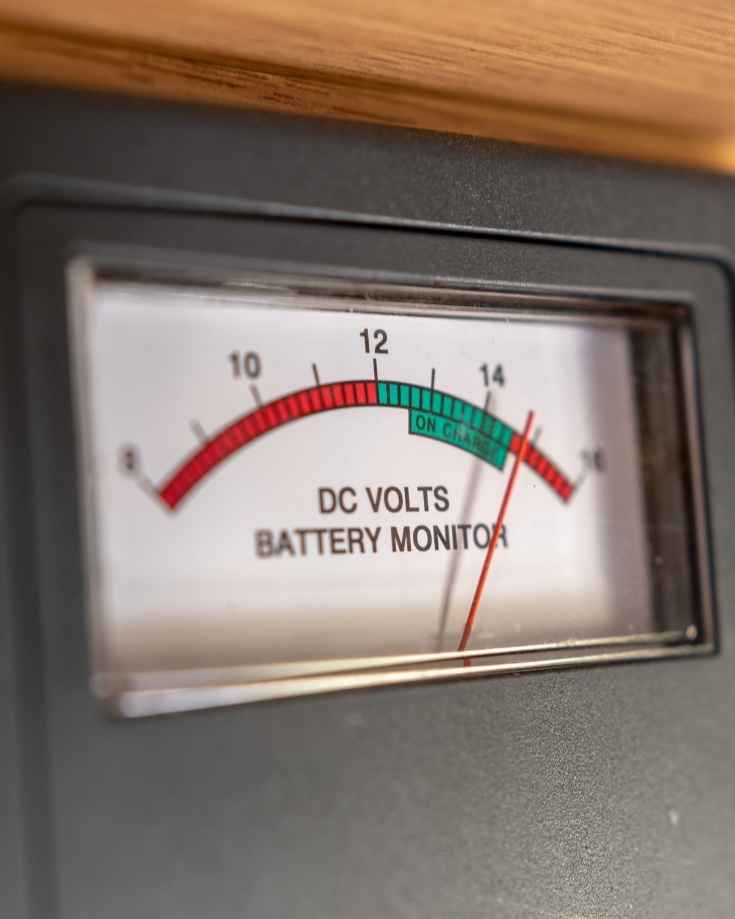 RV battery monitoring gauge reading high DC voltage