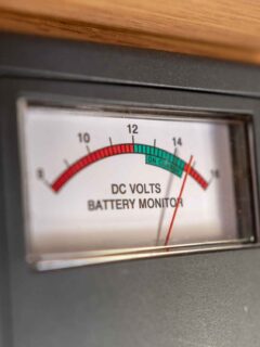 RV battery monitoring gauge reading high DC voltage