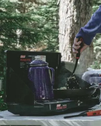 Colemans camping stove is ideal for making coffee in camp and cooking breakfast at the same time