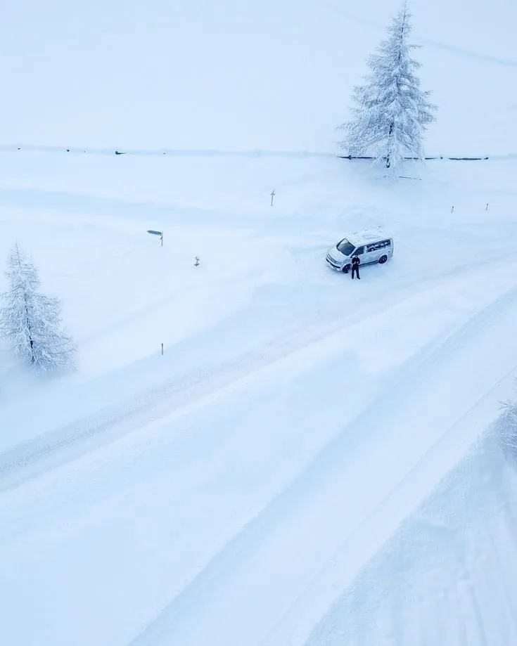 a motorhome in a winter setting with deep snow
