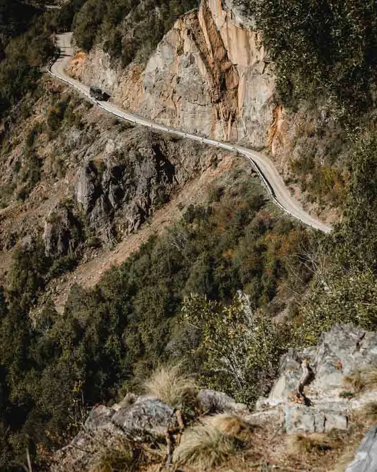Driving a road hugging the mountainside in Patagonia