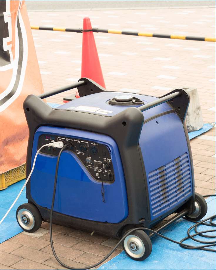 Portable generator next to an RV for power supply