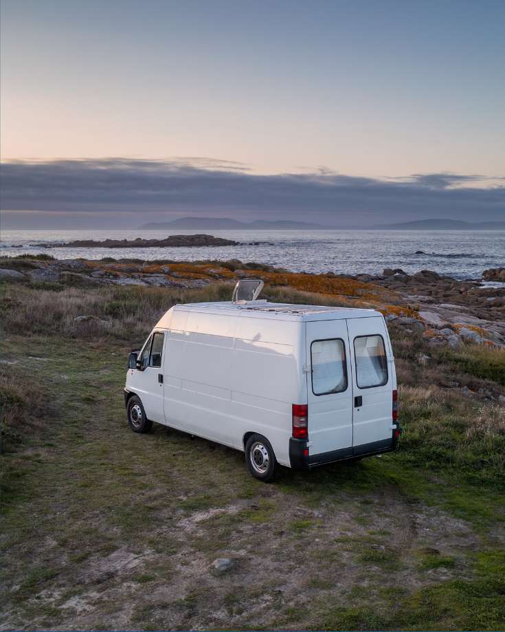 An RV parked in a scenic location, benefiting from an efficient MPPT charge controller