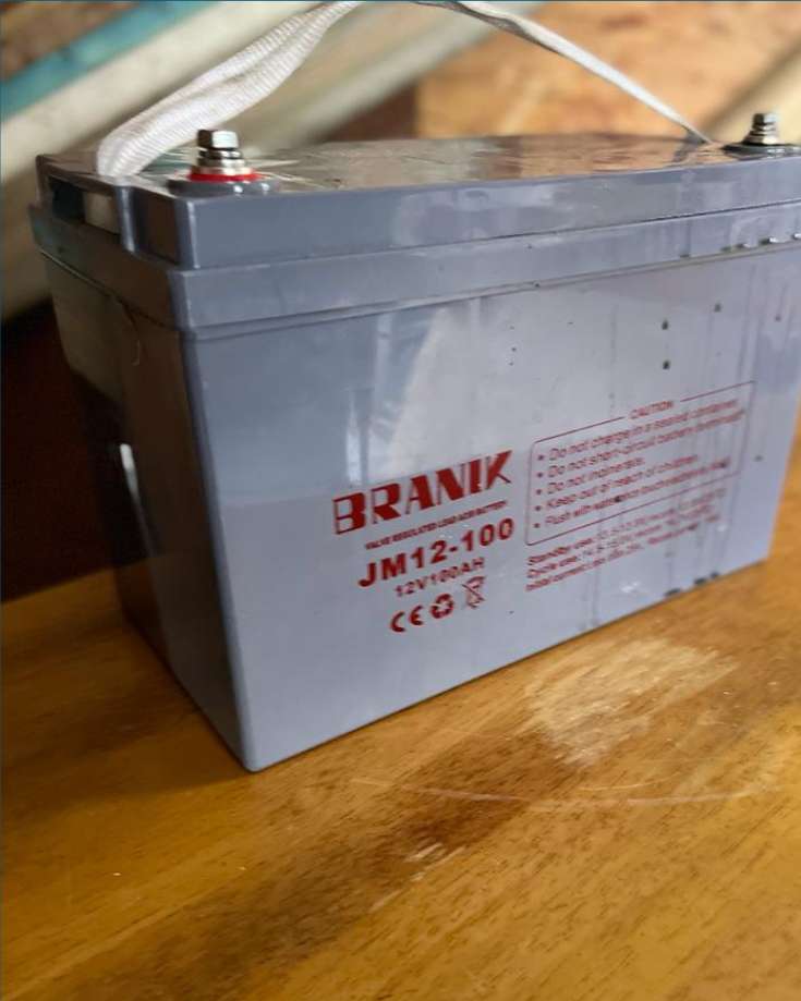 A close-up view of an AGM battery used in RVs and camper vans.