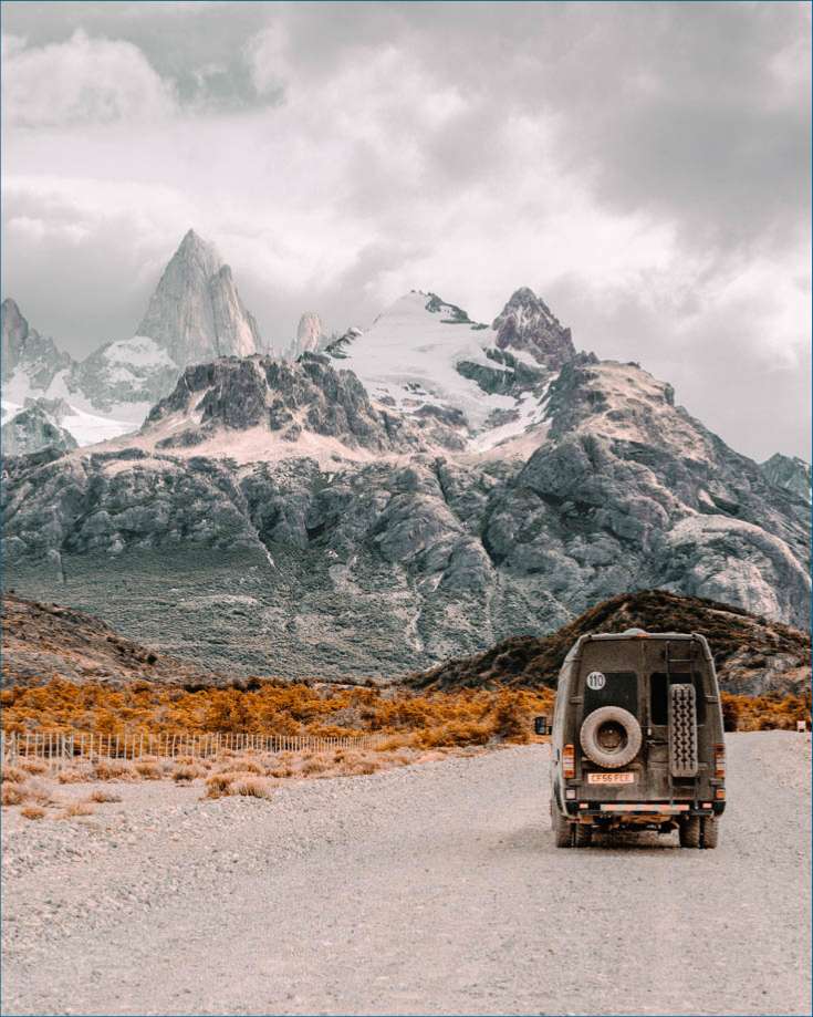 RV with mountains in front of it