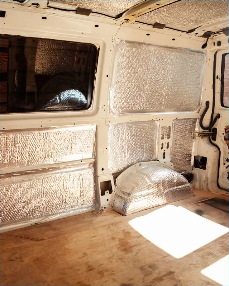 inside of a van during a remodel showing the insulation strips