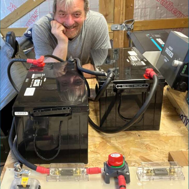 Close-up of a camper examining his RV battery