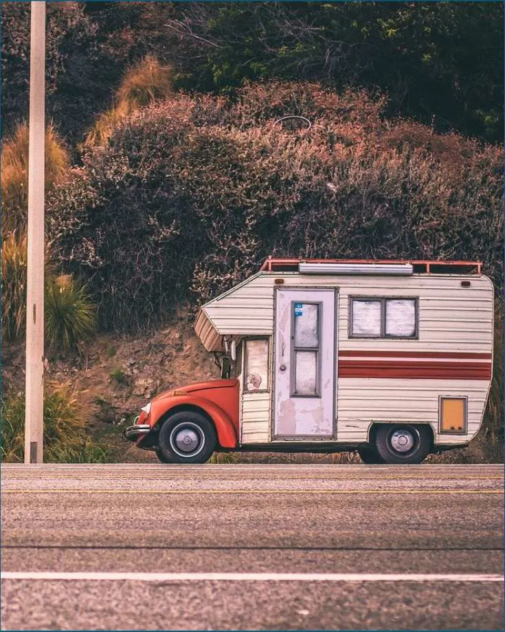 An RV parked at a national forest, a cost-effective camping option.