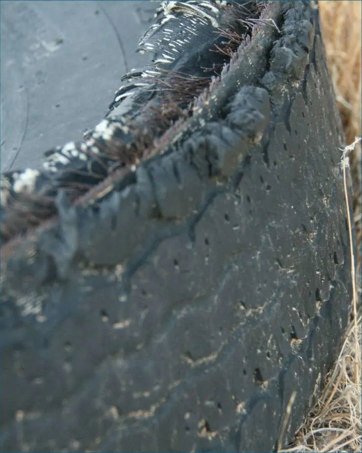 A damaged RV tire, demonstrating what a blowout can look like.