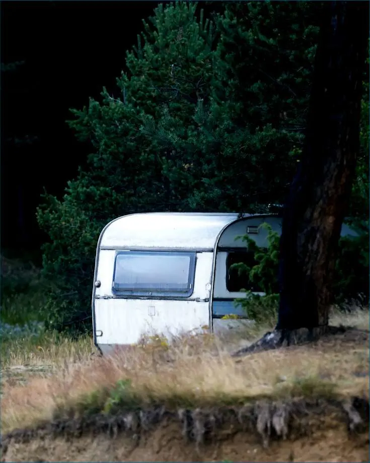 RV parked in a picturesque campsite, highlighting the peace of mind that comes with proper tire care.